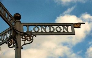 A cast iron sign saying "London" with a pointing finger