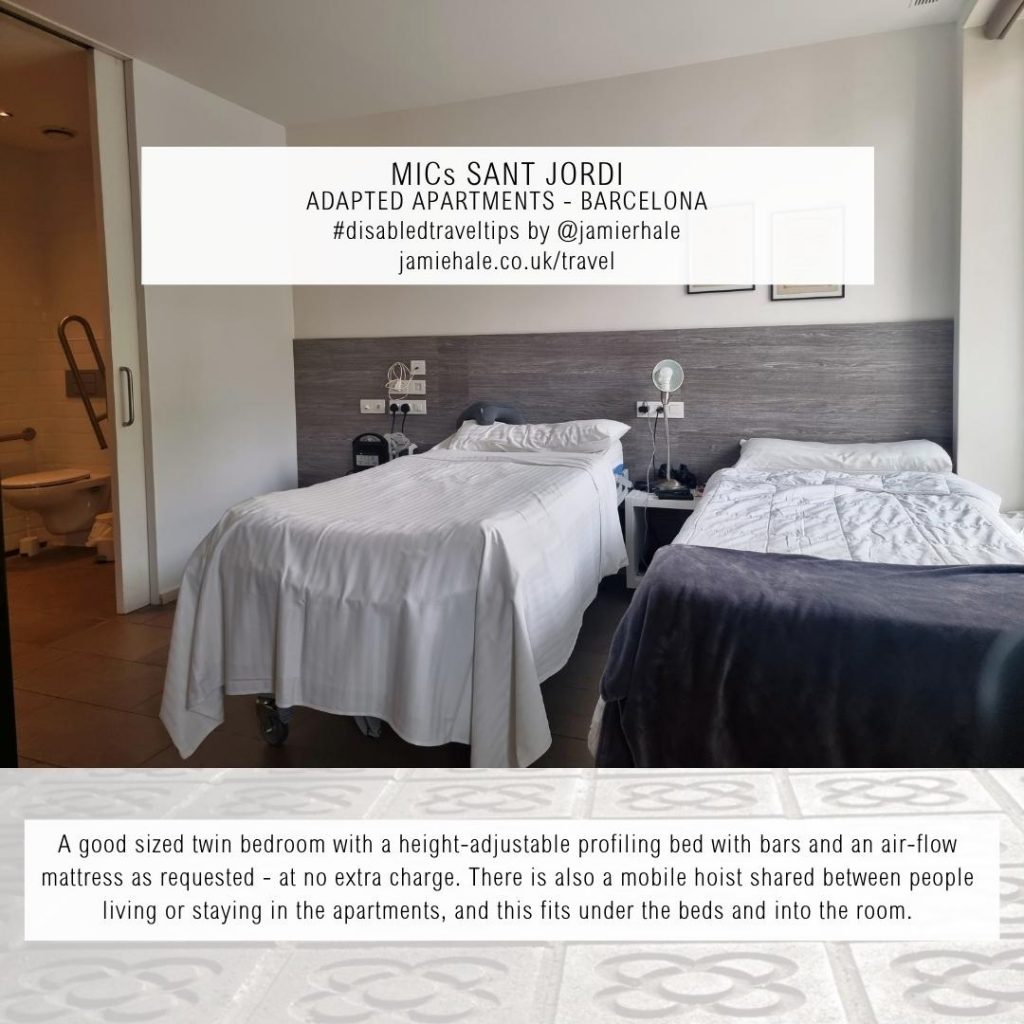 Superimposed on top of a photo in which the top three quarters shows two single beds separated by a bedside table, with a adapted bathroom on the far left, where you can see a toilet and a lowering grab rail. The bottom quarter shows and image of some Barcelona pavots, or paving stones is the text "MICs Sant Jordi, adapted apartments, Barcelona, BLANK, #DisabledTravelTips by @jamierhale jamiehale.co.uk/travel"