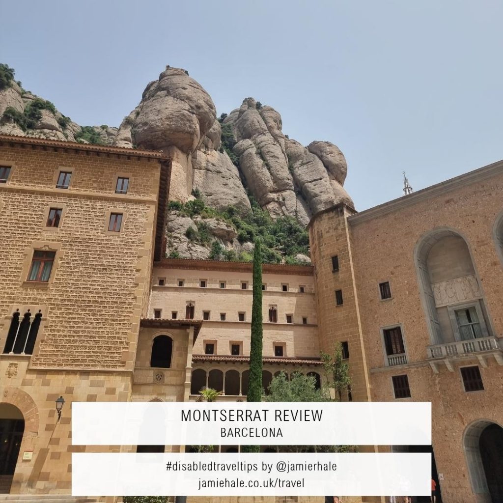 Superimposed on top of a photo of large sandstone buildings with a rockface in the background is the text "Montserrat Review Barcelona. #DisabledTravelTips by @jamierhale jamiehale.co.uk/travel"