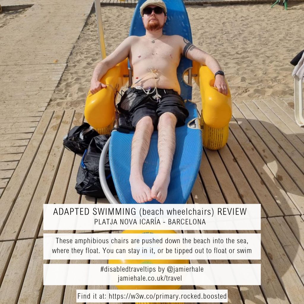 A photo of Jamie Hale reclined on a beach wheelchair. Superimposed over the top is text reading 'Adapted Swimming (beach wheelchairs) Review - Platja Nova Icaria - Barcelona', 'These amphibious chairs are pushed down the beach into the sea, where they float. You can stay in it, or be tipped out to float or swim', '#disabledtraveltips by @jamierhale jamiehale.co.uk/travel', 'Find it at: https://w3w.co/primary.rocked.boosted '