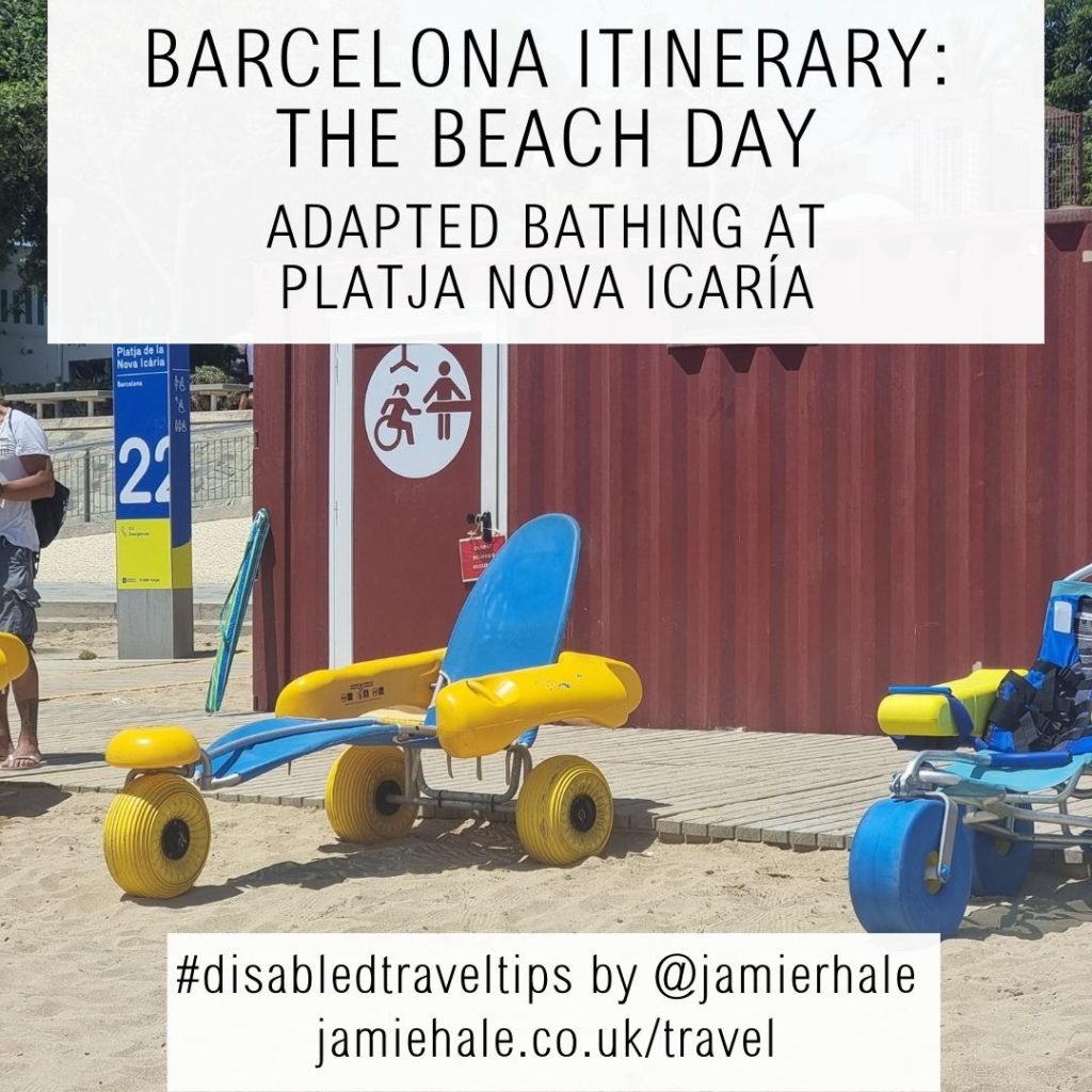 A photo of a beach wheelchair on the sand next to a wooden boardwalk, with a changing facility made from a shipping contained in the background. Superimposed over the top of the image is text reading 'Barcelona itinerary: the beach day', 'Adapted bathing at Platja Nova Icaria', '#disabledtraveltips by @jamierhale jamiehale.co.uk/travel'
