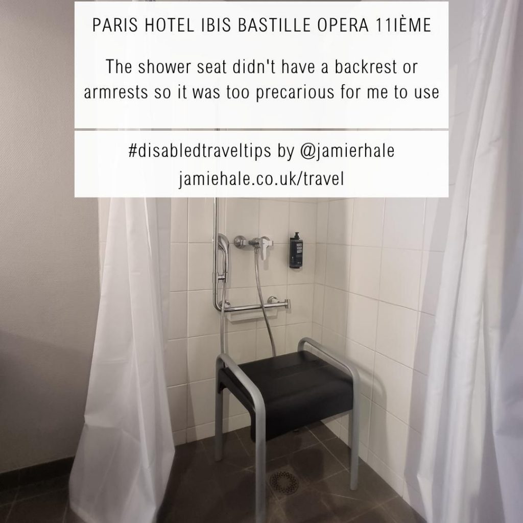 Superimposed on top of a picture of a hotel desk and clothes rails is the text "Paris (Hotel Ibis Bastille Opera 11ième, the shower chair didn't have a backrest or armrests so it was too precarious for me to use #DisabledTravelTips by @jamierhale jamiehale.co.uk/travel"