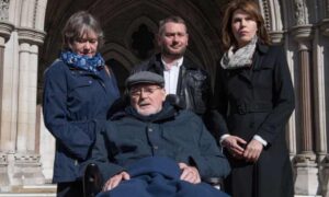 Noel Conway, a campaigner for assisted suicide, outside the High Court with other people